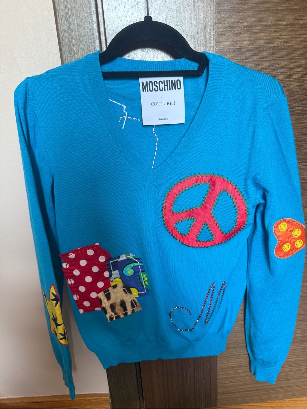 Moschino Turquoise V-Neck Sweater with Pink Peace Sign and Multicolor Patches